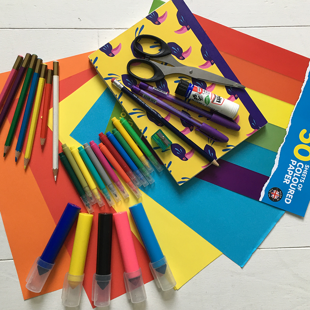 A selection of child's art supplies laid out on a table