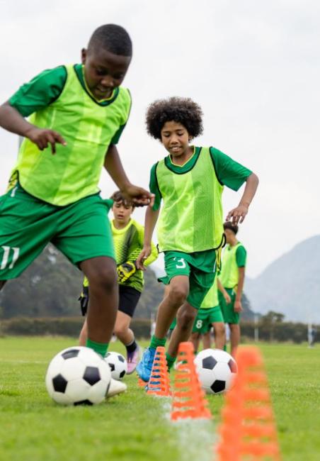Two kids playing football 