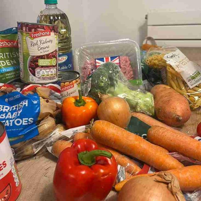 A selection of food placed on a wooden table