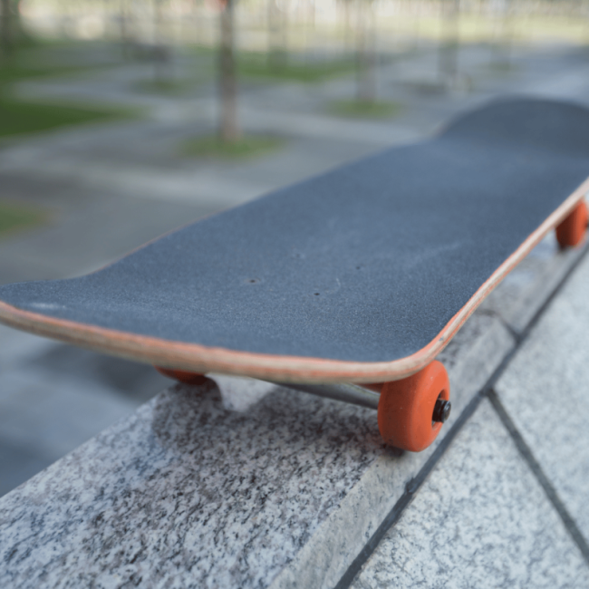 Skateboard resting on a wall