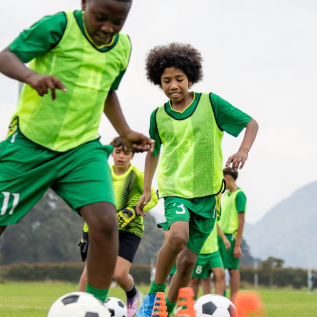 Two kids playing football