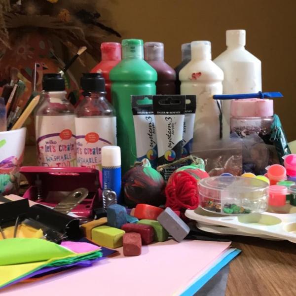 A selection of kids craft activities and resources laid out on a table 