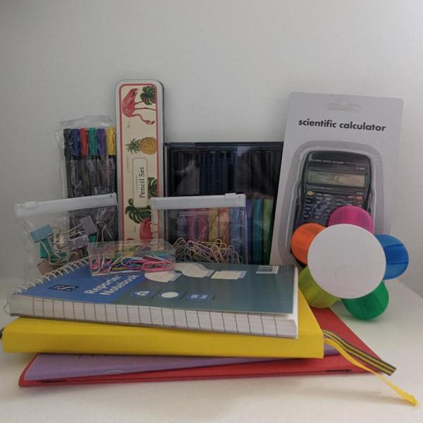 A bundle of school stationary including a caluclator and notepads