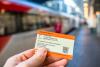 A picture of a hand holding a national rail train ticket