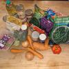 A range of vegetable and store cupboard food on a wooden table