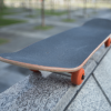 Skateboard resting on a wall